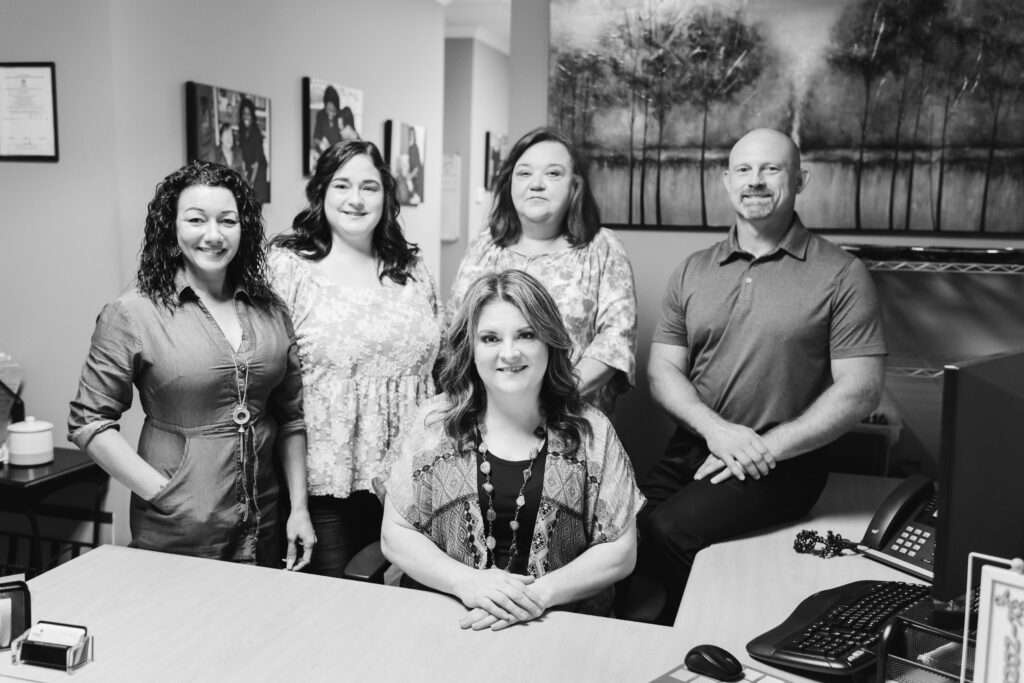 Oasis In-Home Care Office Staff Group Photo in Black and White